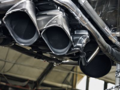 Complete exhaust system installation process with professional tools and equipment